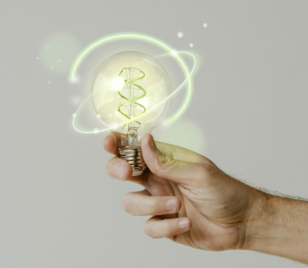 green-energy-with-hand-holding-environmental-light-bulb-background (2)